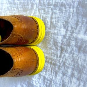Women’s Cole Haan wingtip shoes.
